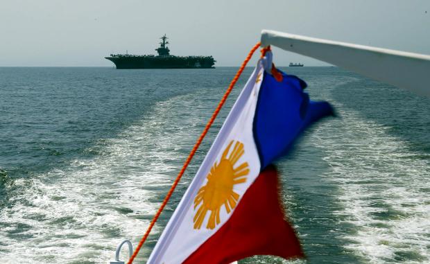Philippine flag foreground of USS Carl Vinson - 17 Feb 2018