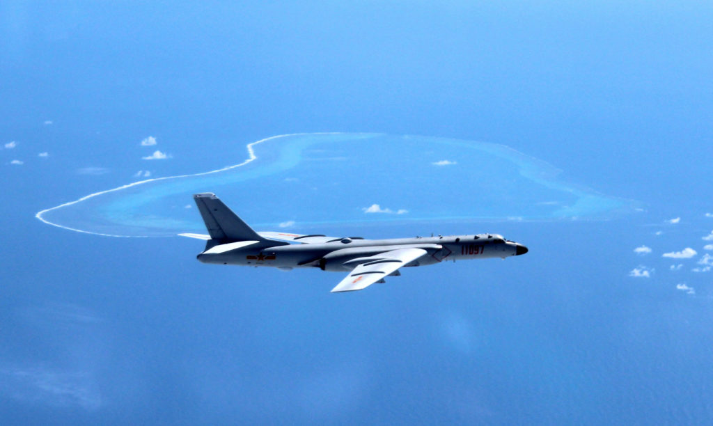 FILE - In this undated file photo released by Xinhua News Agency, a Chinese H-6K bomber patrols the islands and reefs in the South China Sea. The China Daily newspaper reported Saturday, May 19, 2018 that People's Liberation Army Air Force conducted takeoff and landing training with the H-6K bomber in the South China Sea. (Liu Rui/Xinhua via AP, File)