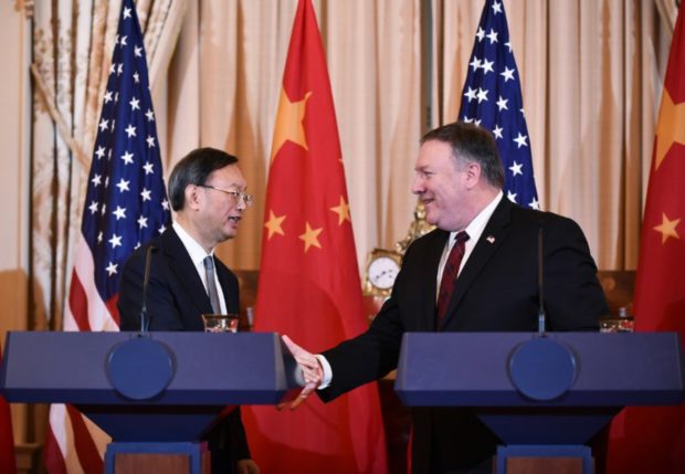 US China Security Dialogue South China Sea US Secretary of State Mike Pompeo and Chinese politburo member Yang Jiechi shake hands following a press conference with during the US-China Diplomatic and Security Dialogue in the Benjamin Franklin Room of the State Department in Washington, DC on November 9, 2018. (Photo by MANDEL NGAN / AFP)