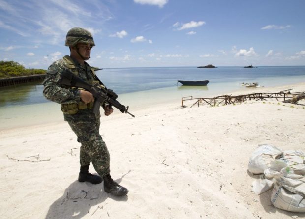 China asserted its sovereign rights over Pagasa Island on Thursday, accusing the Philippines, in return, of “illegally occupying” the area.