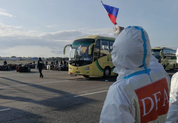 The DFA welcomed 440 repatriated OFWs on Friday morning. Image: DFA-OUMWA
