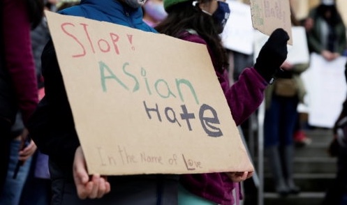 Sign against hate crimes vs Asians