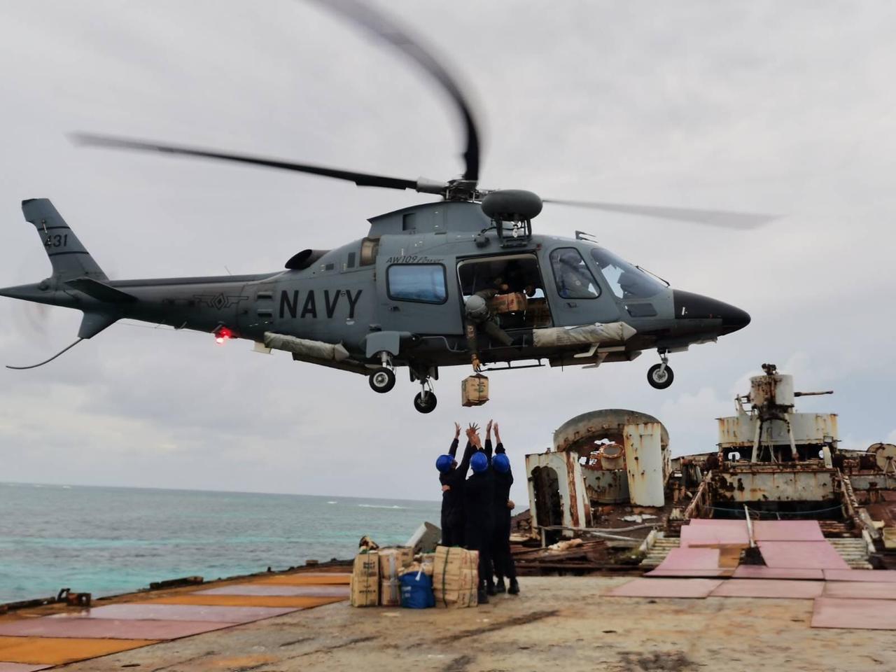 The Philippine Navy drops supplies into remote Philippine-held islands in the West Philippine Sea on Christmas Day