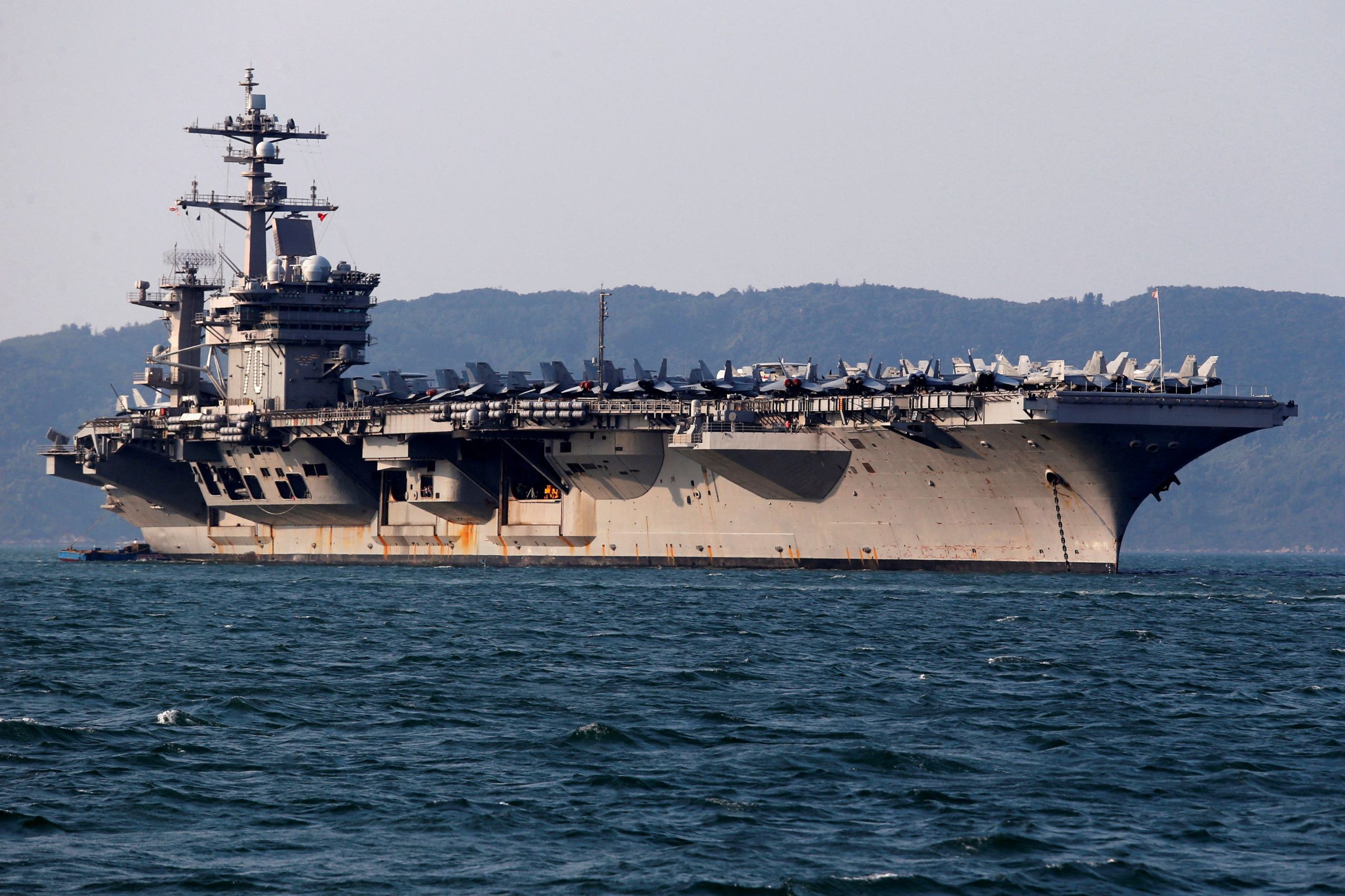 FILE PHOTO: U.S. Navy aircraft carrier, USS Carl Vinson, docks at a port in Danang, Vietnam March 5, 2018. REUTERS/Kham/File Photo