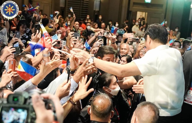 Ferdinand Marcos with Filipinos in Thailand STORY: PH labor office to rise in Thailand