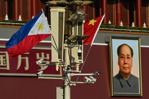The national flags of the Philippines and China are seen together near the Tiananmen Gate. STORY: PH expects up to $2 billion in China investments to revive steel industry 