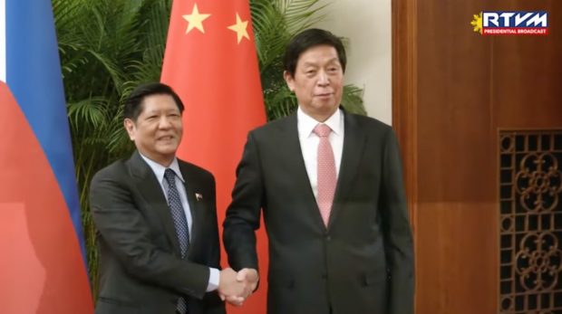 President Ferdinand Marcos Jr. meets Li Zhanshu, chairman of the Standing Committee of the National People’s Congress, during the first full day of his state visit to China on Wednesday, January 4, 2022.