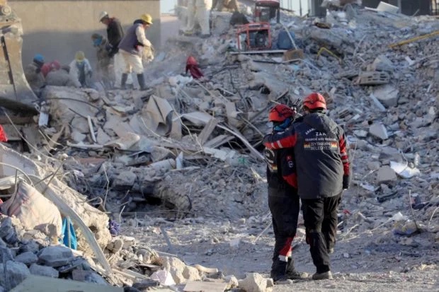 Rescuers in Turkey amid quake rubble. STORY: Filipino, 3 kids still missing in Turkey after quake