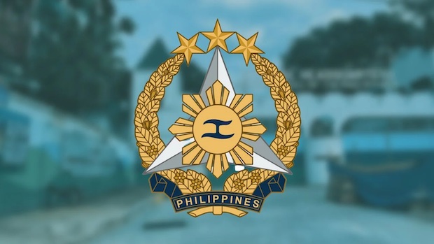 Armed Forces of the Philippines logo on blurred background of HQ