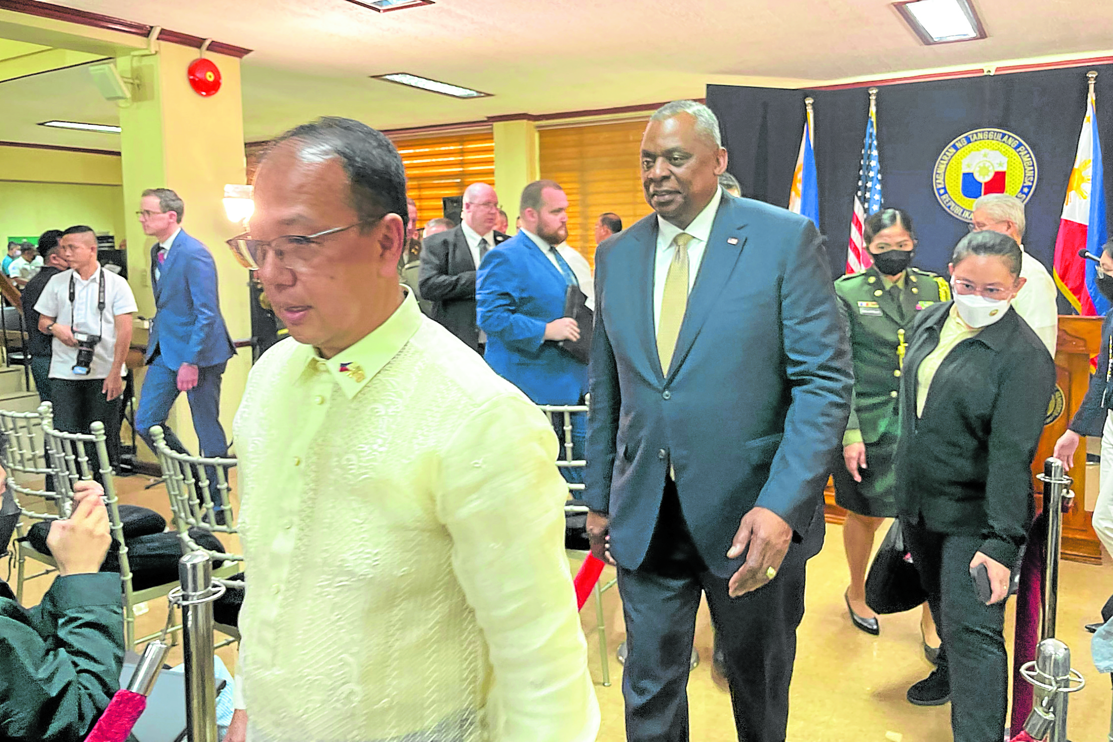 Lloyd Austin III, shown here as he walks behind DefenseSecretary Carlito Galvez Jr. following a joint press conference at Camp Aguinaldo on Thursday