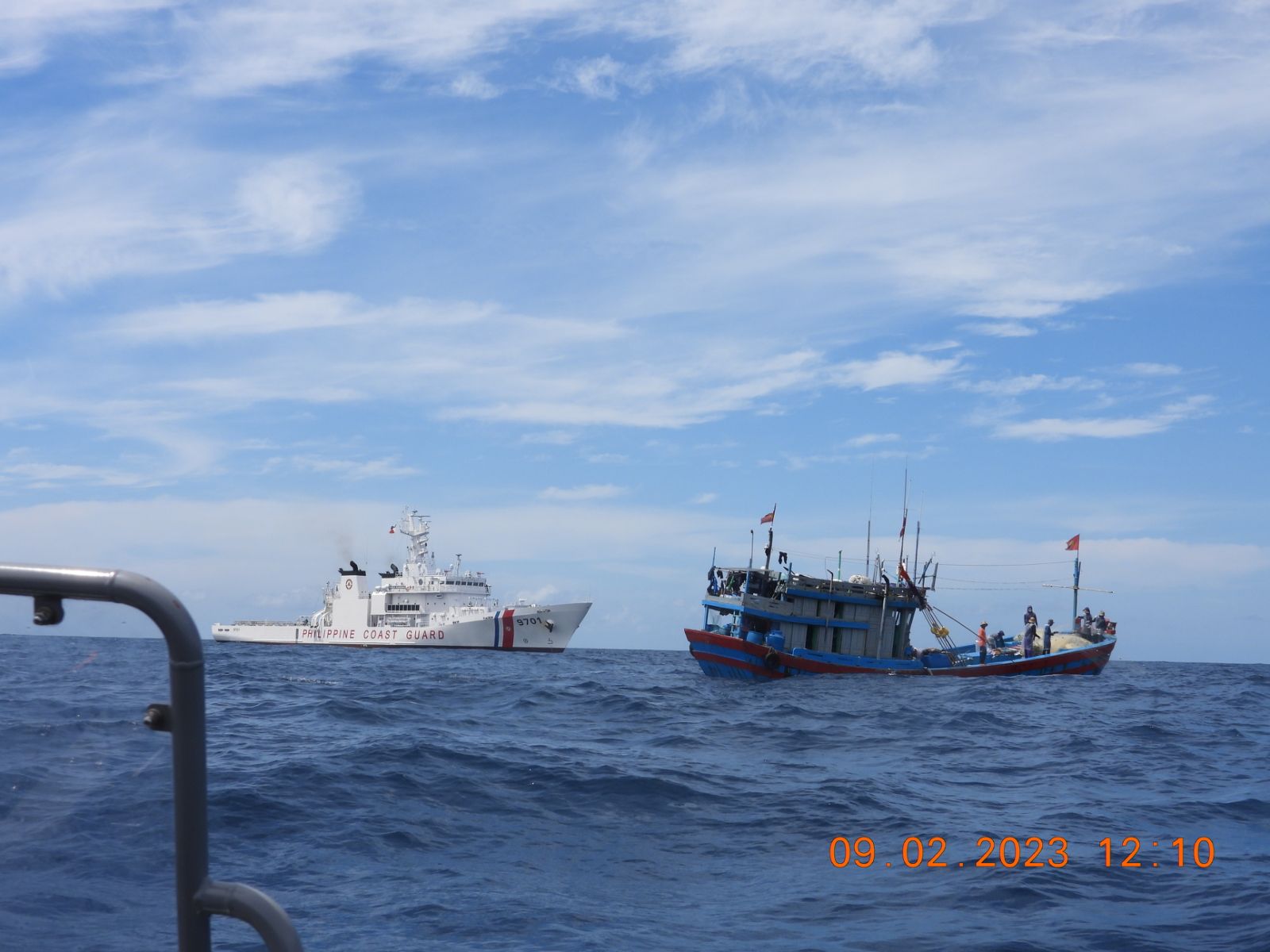 BRP Teresa Magbanua of the Philippine Coast Guard flags a Vietnamese fishing vessel in Recto Bank in the West Philippine Sea. 