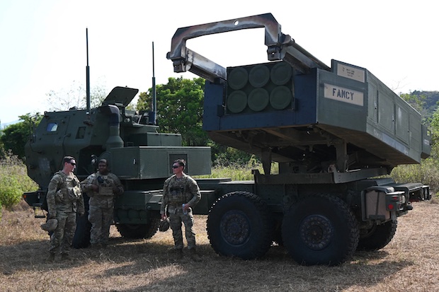 US Army soldiers standing next to their high mobility artillery rocket system (HIMARS). STORY: ‘Combat-ready’ force in biggest ‘Balikatan’