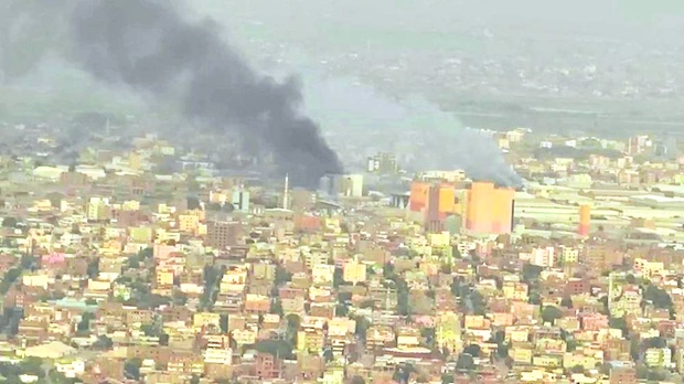 Smoke rising from a burning building in Khartoum. STORY: Evacuation of OFWs in Sudan under way – DFA