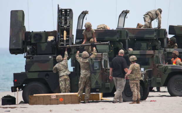 WAR GAMES PREP American soldiers prepare missiles for the Avenger air defense system, a self-propelled surface-to-air missile system, during a live-fire demonstration in this year’s Philippine-US “Balikatan” military exercises in San Antonio, Zambales, on Tuesday. —MARIANNE BERMUDEZ