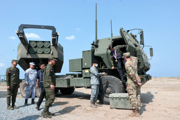 President Marcos, seen here alighting a truck equipped with US High-Mobility Artillery Rocket Systems, is the first Philippine leader in 12 years to attend the annual “Balikatan” exercises between the United States and the Philippines, in San Antonio, Zambales, on Wednesday.