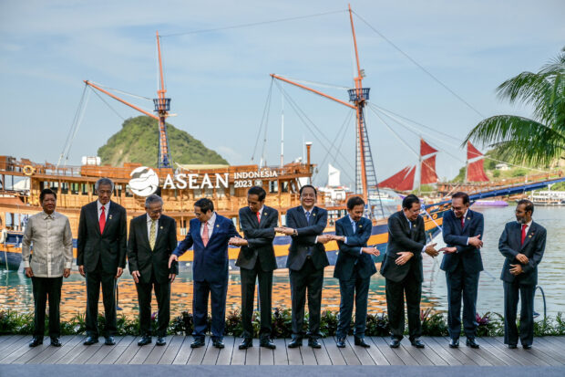 (L-R) Philippine President Ferdinand Marcos, Singapore's Prime Minister Lee Hsien Loong, Thailand's Deputy Prime Minister Don Pramudwinai, Vietnam's Prime Minister Pham Minh Chinh, Indonesia's President Joko Widodo, Laos' Prime Minister Sonexay Siphandone, Brunei's Prime Minister Hassanal Bolkiah, Cambodia's President Hun Sen, Malaysia's Prime Minister Anwar Ibrahim and East Timor's Prime Minister Taur Matan Ruak pose for family photo during the Association of Southeast Asian Nations (ASEAN) Summit in Labuan Bajo on May 10, 2023. (Photo by BAY ISMOYO / POOL / AFP)