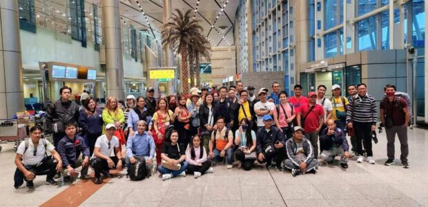 A total of 99 overseas Filipino workers (OFWs) who were rescued from Sudan will arrive in the country on Sunday evening, the DMW said. Photo courtesy of DMW