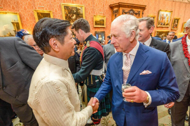 President Marcos and King Charles III shakehands at a reception for heads of states in Buckingham Palace on Saturday morning before the coronation rites