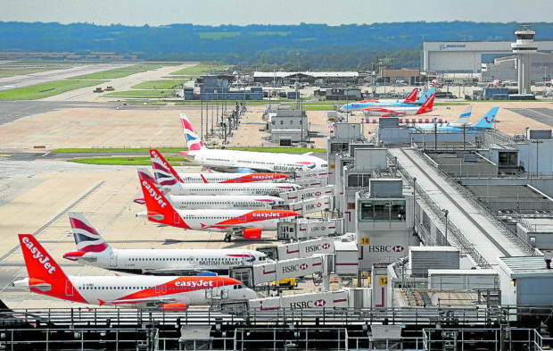 File photo shows passengers jets loadand unload passengers and cargo at London Gatwick Airport outside of London.
