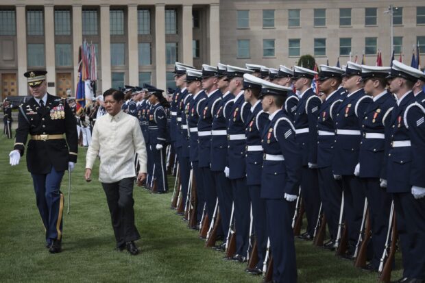 President Marcos is escorted by Commander of Troops Army Col. David Rowland, during an arrival ceremony at the Pentagon on May 3. US Defense Secretary Lloyd Austin III later assured Mr. Marcos: “We will always have your back in the South China Sea and elsewhere in the region.”