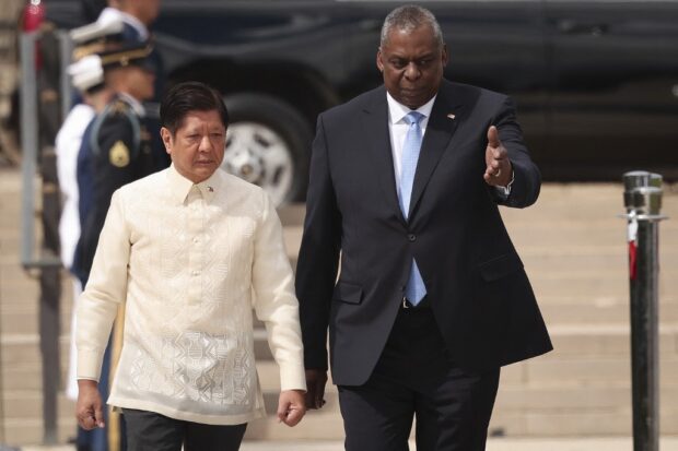 Philippines President Ferdinand Romualdez Marcos Jr. (L), is escorted by U.S. Secretary of Defense Lloyd Austin (R) during an arrival ceremony at the Pentagon May 3, 2023 in Arlington, Virginia.