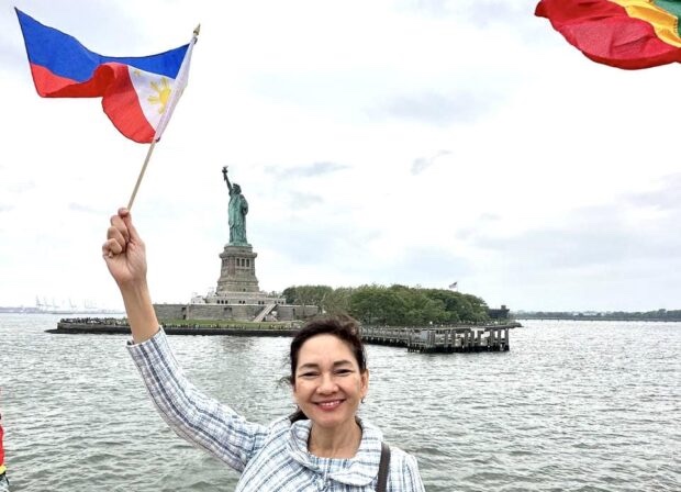 Risa Hontiveros near the Statue of Liberty