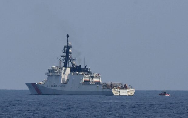 Members of the Philippine Coastguard conduct maritime law enforcement on June 6, 2023, during the trilateral exercise with the US Coast Guard and Japanese Coast Guard off the coast of Mariveles, Bataan province facing the West Philippine Sea. It is the first-ever trilateral exercise between the three countries. STORY: PH, US and Japan OK more activities in WPS
