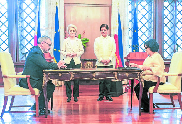 AGREEMENT Department of Environment and Natural Resources (DENR) Secretary Maria Antonia Yulo Loyzaga (seated, right) and Ambassador of the European Union (EU) in the Philippines Luc Veron sign the bilateral agreement on the Joint Declaration on the Green Economy Programbetween the Philippines and the EU in Malacañang on Monday. President Marcos and European Commission President Ursula von der Leyen served as witnesses. —DENR FACEBOOK PAGE