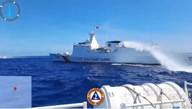 A China Coast Guard ship turning on its water cannons against Philippine vessels near Ayungin (Second Thomas) Shoal on Aug. 5, 2023. 