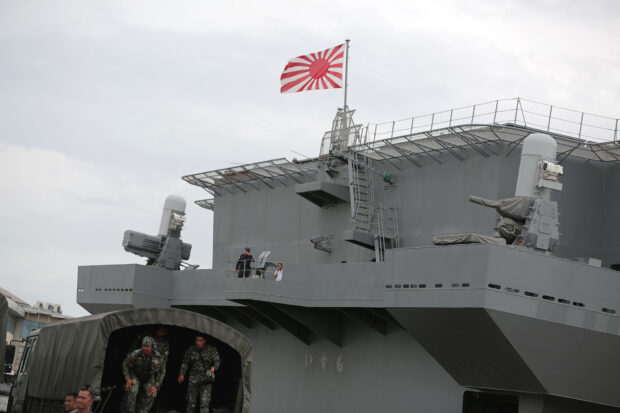 The JS Izumo at Manila’s South Harbor where it docked next to US aircraft carrier USS America.