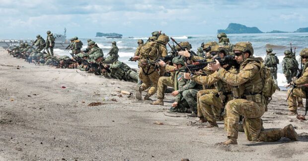 Troops from the Philippines and Australia simulate a territory-retaking scenario at the shores of Naval Station Leovigildo Gantioqui located in San Antonio, Zambales as part of Exercise "Alon" 2023, the first-ever amphibious exercise between the two countries. PHOTO FROM THE AUSTRALIAN GOVERNMENT DEFENCE IMAGES.