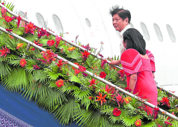 ‘CONSTRUCTIVEENGAGEMENTS’ PresidentMarcos and first lady Liza Araneta-Marcos board the plane to Jakarta, host of the three-dayAsean summitwhich begins today.—MARIANNEBERMUDEZ