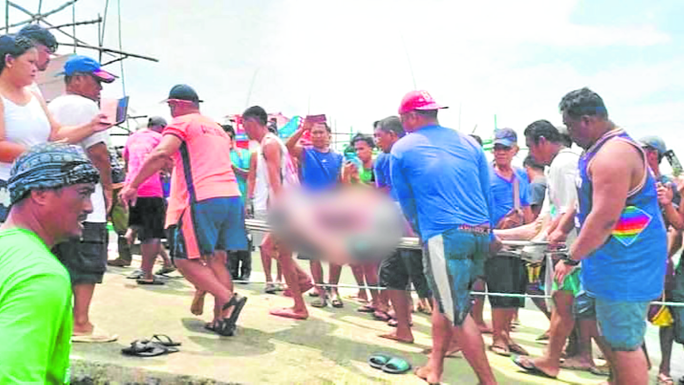 The bodies of the three victims are brought to shore on Tuesday in Infanta, Pangasinan. —PCG PHOTO ship pcg PCG ship claims investigation fishermen