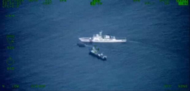 In this screenshot of a video taken by the Armed Forces of the Philippines some 2 kilometers east of Ayungin (Second Thomas) Shoal, China Coast Guard Vessel No. 5203 blocks a boat contracted by the AFP for a resupply mission on Sunday morning in that area of the West Philippine Sea.