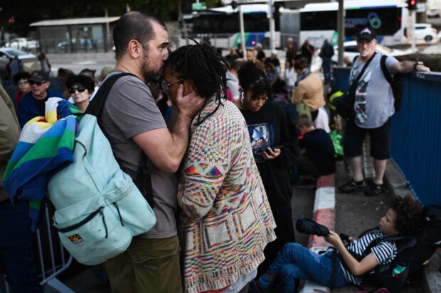 SAFE PASSAGE American citizens gather at the port of Haifa as they await word on their evacuation to Cyprus amid the fighting between Israel and Hamas. —AFP