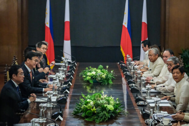 DOWN TO BUSINESS President Marcos and Japanese Prime Minister Fumio Kishida hold a bilateral meeting soon after the Japanese leader’s arrival on Friday. —PPA POOL PHOTO