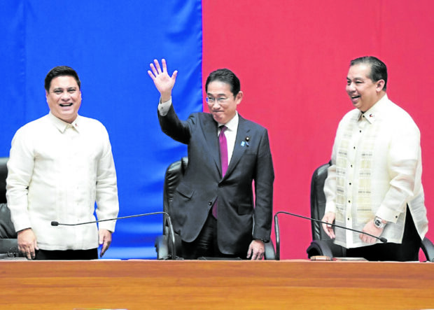 Japanese Prime Minister Fumio Kishida waves to members of the upper and lower houses of the Congress as Senate President Miguel Zubiri (left) and House Speaker Martin Romualdez look on —PHOTO COURTESY OF HOUSE OF REPRESENTATIVES