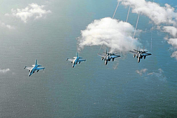 ASSERTION IN THE SKIES Streaking over the West Philippine Sea near Batanes on Nov. 21 is a formation of two FA-50PH aircraftof the Philippine Air Force (left) and two US fighter jets. PHILIPPINE AIR FORCE HANDOUT PHOTO