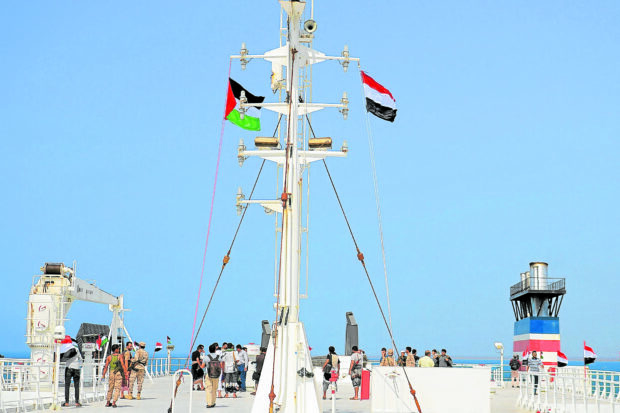CAPTURED SHIP The Galaxy Leader, a cargo ship seized by Yemen’s Houthi rebels on Nov. 20,is shown two days later docked at a port on the Red Sea in the Yemeni province of Hodeida and flying Palestinian and Yemeni flags. The Bahamas-flagged, British-owned vessel operated by a Japanese firmbut with links to an Israeli businessman, was headed from Turkey to India when it was seized along with its 25-member crew, 17 of them Filipinos. The rebel group said the capture was in retaliation for Israel’s war against Hamas, sparked by the Oct. 7 attack of the Palestinian militants who killed 1,200 people and took around 240 hostages, according to Israeli officials. —AFP