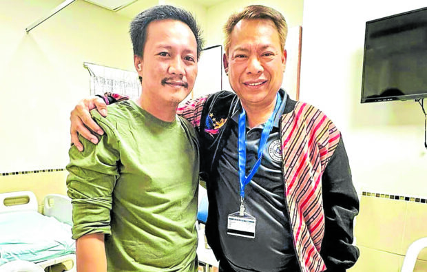 HOME SOON Filipino caregiver Gelienor “Jimmy” Pacheco (left) is looking forward to join his family in the Philippines this Christmas following his release after 49 days in captivity by Hamas militants. Pacheco, who is undergoing medical examinations in a hospital in Israel, is joined in this photo by Philippine Ambassador to Israel Pedro Laylo Jr. —PHOTO COURTESY OF PHILIPPINE EMBASSY IN ISRAEL