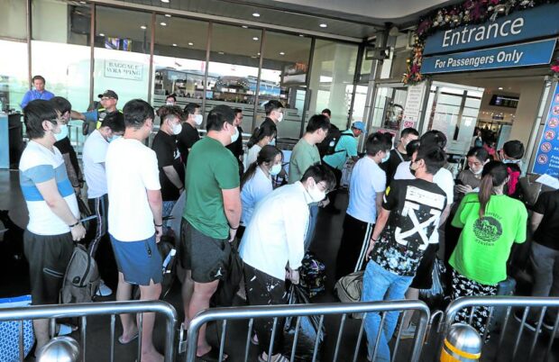 Thursday’s mass deportation involved Chinese nationals who were arrested in a raid on a Pasay City-based Philippine offshore gaming operator (Pogo) hub in October. They werefound to have no working permits and engaged in “online scams.” Photo shows them lining up for predeparture procedures at Terminal 3 of Ninoy Aquino International Airport.