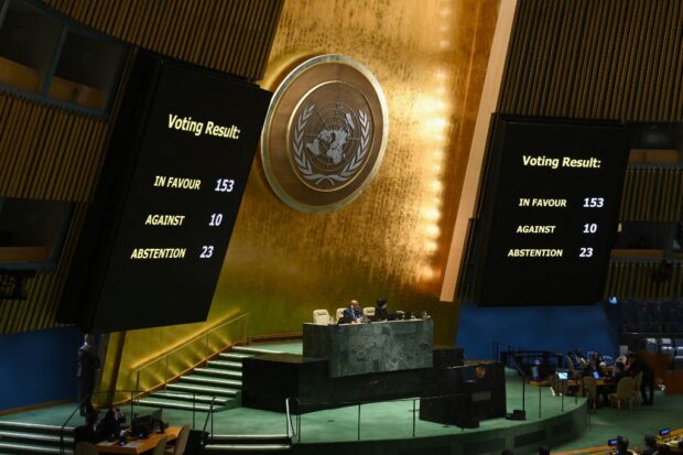 A general view shows voting results during a United Nations General Assembly meeting to vote on a non-binding resolution demanding "an immediate humanitarian ceasefire" in Gaza at UN headquarters in New York on December 12, 2023. 