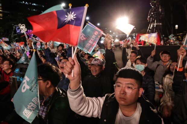 Supporters of Taiwan People's Party (TPP) presidential candidate Ko Wen-je wait for the results of the presidential election at the TPP headquarters in Xinzhuang in New Taipei City on January 13, 2024. (Photo by I-Hwa CHENG / AFP)