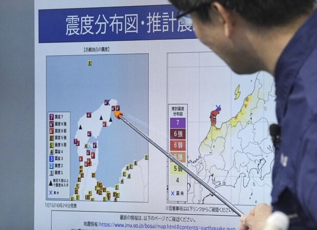 A staff member of Japan Meterological Agency speaks at a press conference in Tokyo Monday, Jan. 1, 2024, following an earthquake. Japan issued tsunami alerts and told people to evacuate seaside areas after a series of strong quakes on its western coastline Monday, Jan. 1, 2024.