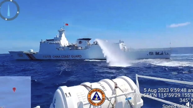 AGGRESSION A China Coast Guard ship fires its water cannon at Philippine Coast Guard (PCG) vessels escorting supply boats chartered by the Armed Forces of the Philippines in August 2023. The Philippine boats were delivering supplies to troops at BRP Sierra Madre in Ayungin (Second Thomas) Shoal when confronted by the Chinese. —VIDEOGRAB FROM PCG FACEBOOK PAGE