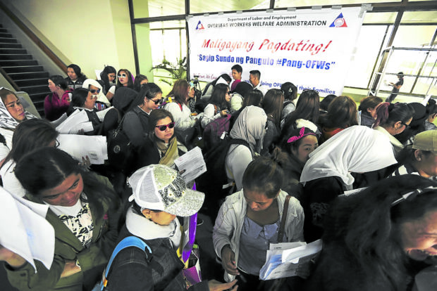 HOME AT LAST In this photo taken in 2018, repatriated overseas Filipinoworkers fromKuwait fill out information sheet as they arrive at Ninoy Aquino International Airport. —NIÑO JESUS ORBETA
