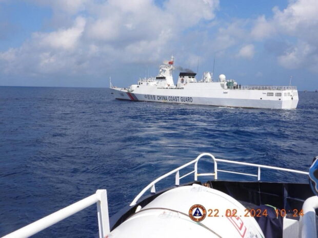 SIGNAL BLOCKED China Coast Guard (CCG) Vessel No. 3105 sails past BRP Datu Sanday of the Bureau of Fisheries and Aquatic Resources on Feb. 22, when the CCG allegedly blocked the Philippine vessel’s signal. —PHOTO COURTESY OF PHILIPPINE COAST GUARD