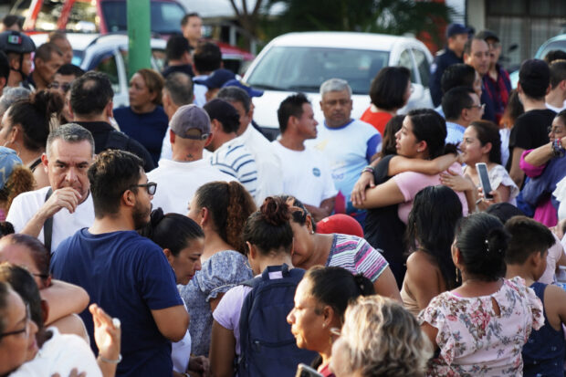 Relatives of the kidnapped police employees greet their loved ones after being released in Tuxtla Gutierrez, Chiapas state, Mexico on June 30, 2023. A group of 16 police employees who were kidnapped last Tuesday in the southern Mexican state of Chiapas were released this Friday, state governor Rutilio Escandon reported.RAUL MENDOZA / AFP