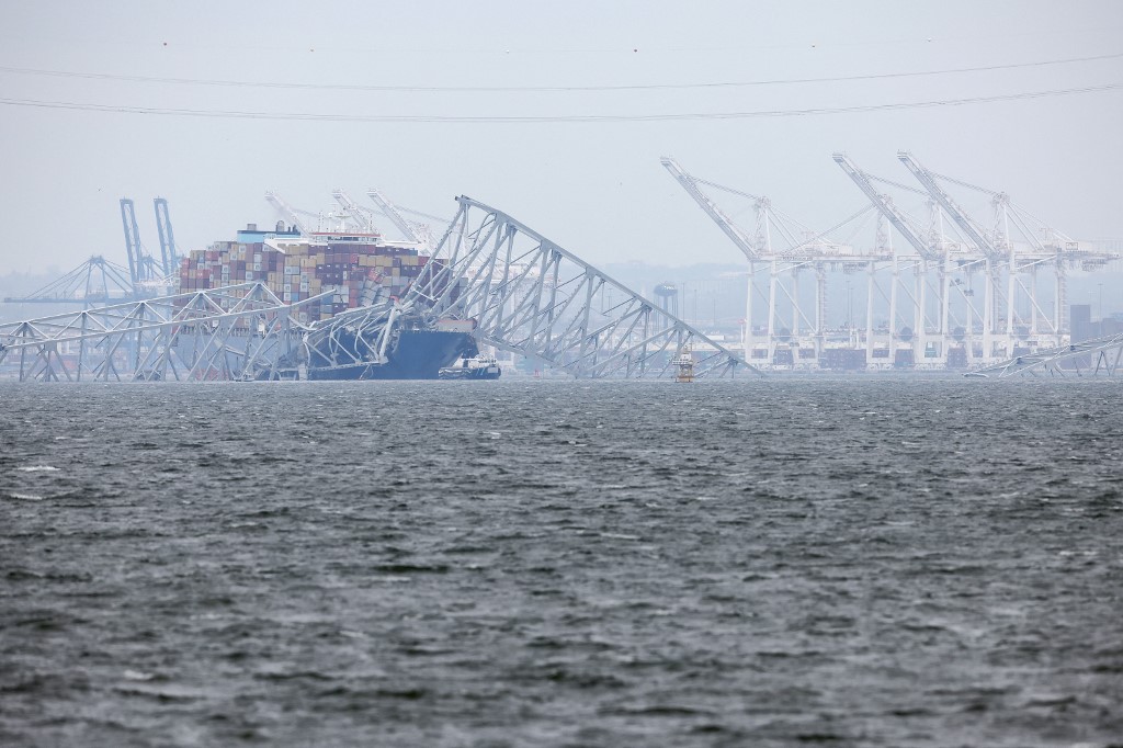 A ship carrying a giant crane was en route Thursday to the scene of the catastrophic bridge collapse over Baltimore harbor, as authorities warned of extensive work before the major US port can reopen.