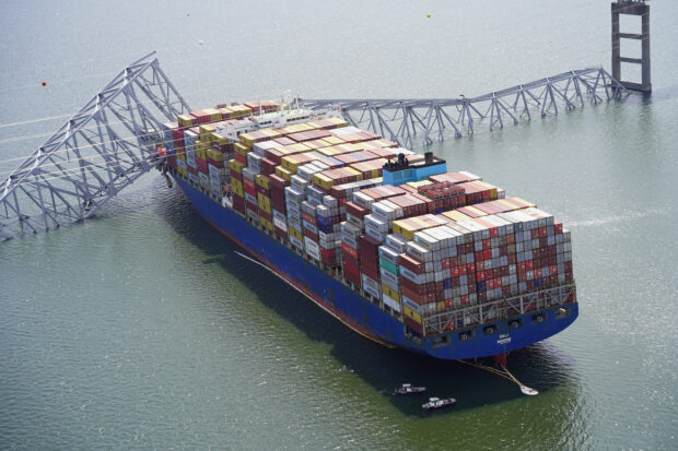 PHOTO: Aerial view of the Dali cargo vessel which crashed into the Francis Scott Key Bridge, causing it to collapse in Baltimore, Maryland, U.S., March 26, 2024. STORY: Freighter pilot called for tugboat help before hitting Baltimore bridge